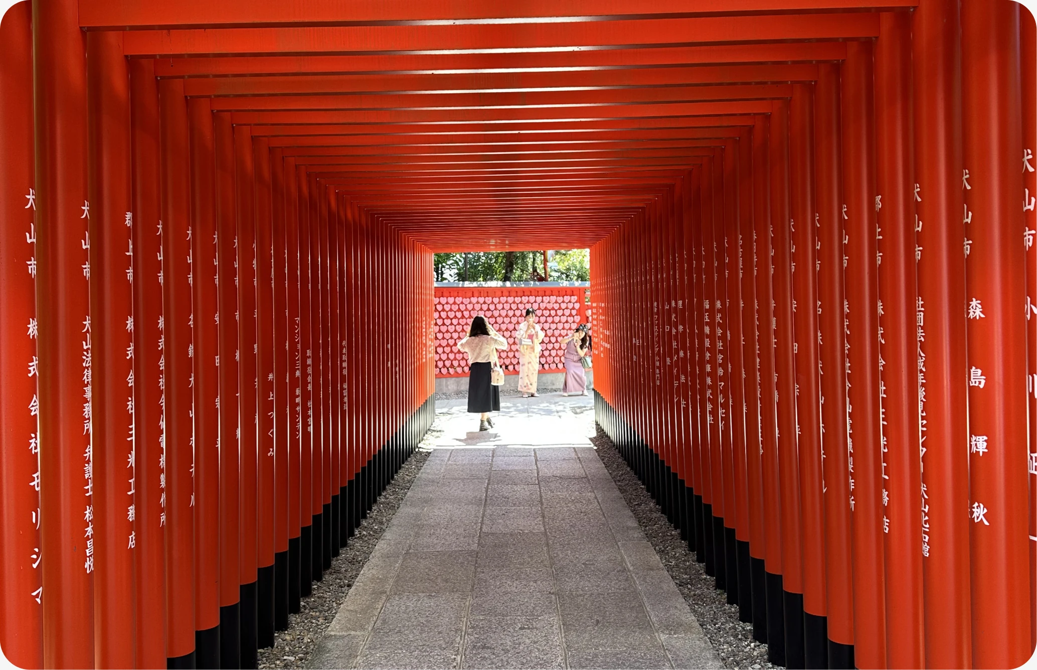 A tunnel of red torii gates at Fushimi Inari